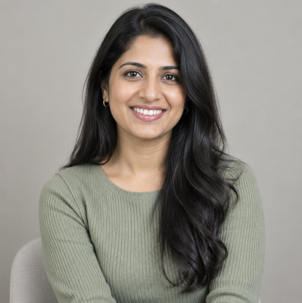 Portrait of a young woman with long dark hair smiling