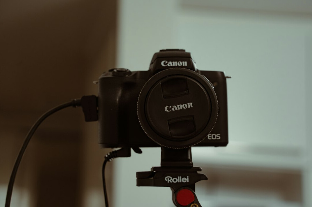 Professional broadcast camera on a tripod in a television studio